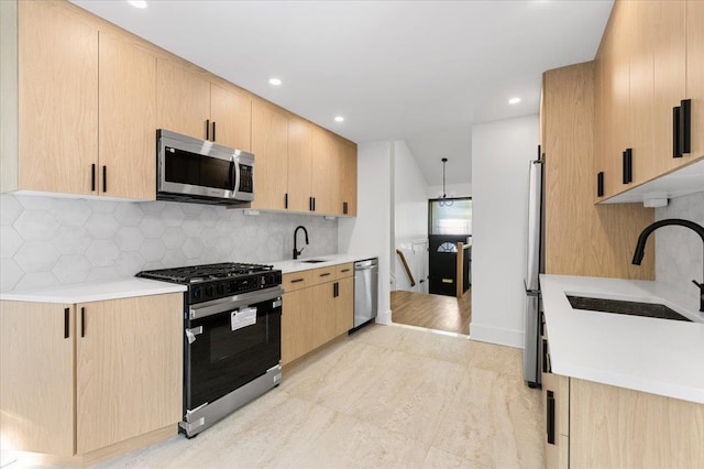 311 Hungry Harbor Rd, North Woodmere, NY 11581 - kitchen with stainless steel appliances, light brown cabinetry, a sink, light countertops, and recessed lighting
