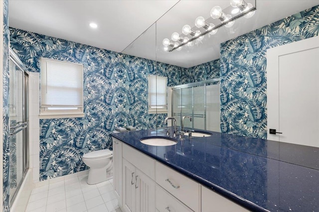 311 Hungry Harbor Rd, North Woodmere, NY 11581 - bathroom with wallpapered walls, toilet, tile patterned flooring, an enclosed shower, and vanity