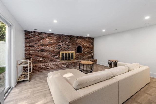 311 Hungry Harbor Rd, North Woodmere, NY 11581 - living room with brick wall, a fireplace, and recessed lighting