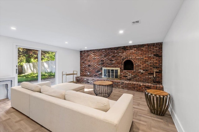 311 Hungry Harbor Rd, North Woodmere, NY 11581 - living room featuring a brick fireplace and recessed lighting