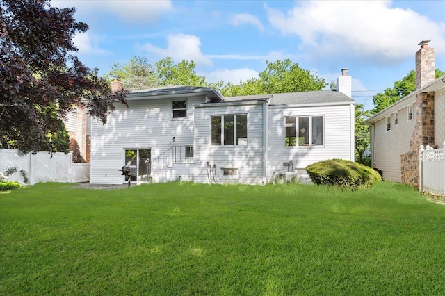 311 Hungry Harbor Rd, North Woodmere, NY 11581 - back of house with a chimney