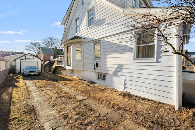 109-44 121st St, South Ozone Park, NY 11420 - view of side of property with an outbuilding and a residential view