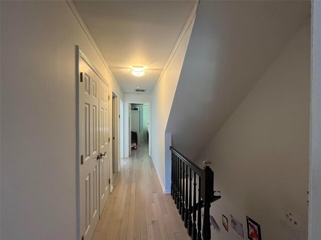 167-11 Powells Cove Blvd Unit 27, Beechhurst, NY 11357 - hallway with an upstairs landing, light wood-type flooring, crown molding, and baseboards