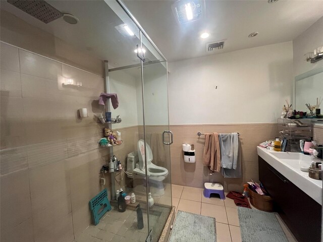 167-11 Powells Cove Blvd Unit 27, Beechhurst, NY 11357 - full bath featuring vanity, a stall shower, tile patterned floors, tile walls, and toilet