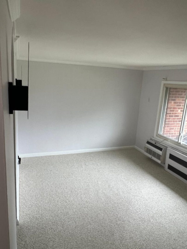 274 Edmunton Dr Unit K8, North Babylon, NY 11703 - carpeted spare room with baseboards and a wall mounted air conditioner