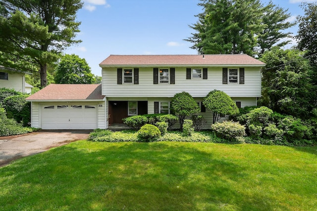 35 Old Farms Rd, Poughkeepsie, NY 12603 - colonial inspired home featuring a garage, concrete driveway, and a front yard