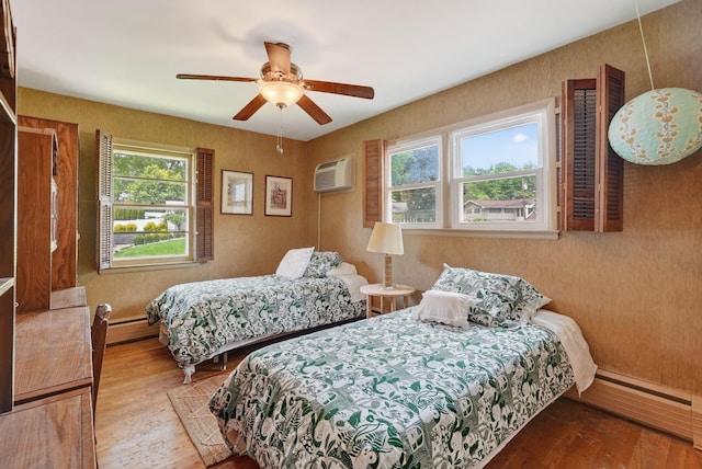 35 Old Farms Rd, Poughkeepsie, NY 12603 - bedroom with hardwood / wood-style floors, multiple windows, baseboard heating, and a baseboard heating unit