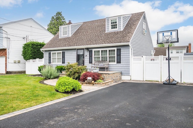 129 Michel Ave, Farmingdale, NY 11735 - cape cod house with a shingled roof, a chimney, and asphalt driveway
