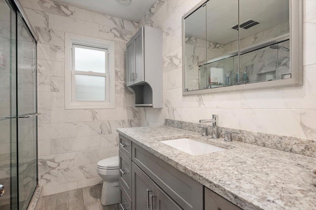 129 Michel Ave, Farmingdale, NY 11735 - bathroom with vanity, tile walls, and a shower stall
