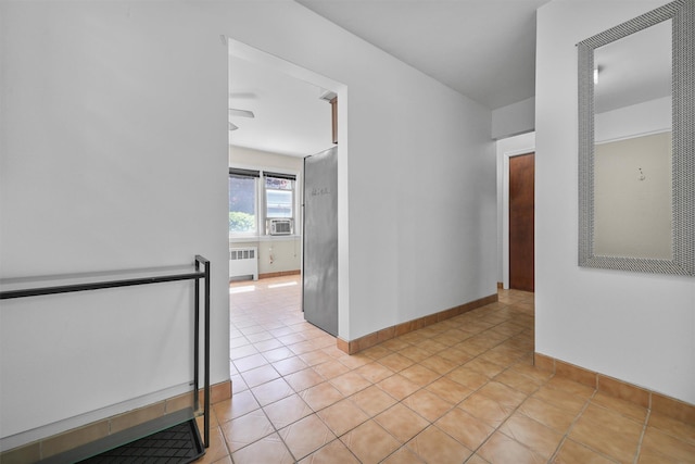 4 Leewood Cir Unit 4L, Eastchester, NY 10709 - spare room with radiator heating unit, cooling unit, light tile patterned floors, and baseboards