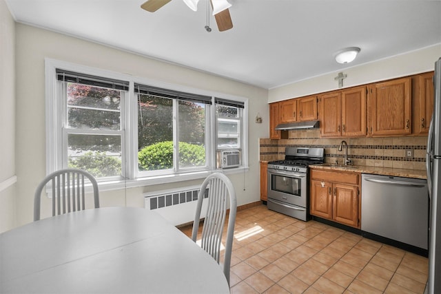 4 Leewood Cir Unit 4L, Eastchester, NY 10709 - kitchen featuring stainless steel appliances, radiator heating unit, under cabinet range hood, ceiling fan, and a sink