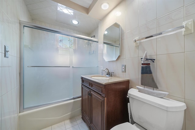 4 Leewood Cir Unit 4L, Eastchester, NY 10709 - bathroom featuring toilet, tile walls, enclosed tub / shower combo, vanity, and tile patterned floors
