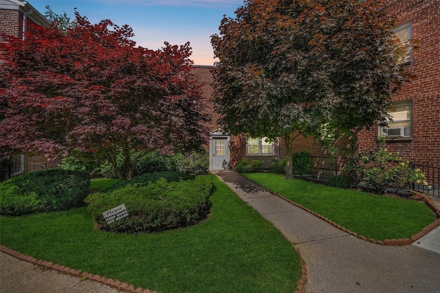 4 Leewood Cir Unit 4L, Eastchester, NY 10709 - view of front of home with brick siding and a lawn