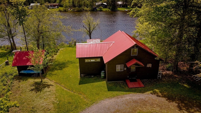 110 Lake Muskoday Rd, Roscoe, NY 12736 - view of front facade with a water view, metal roof, and a front lawn