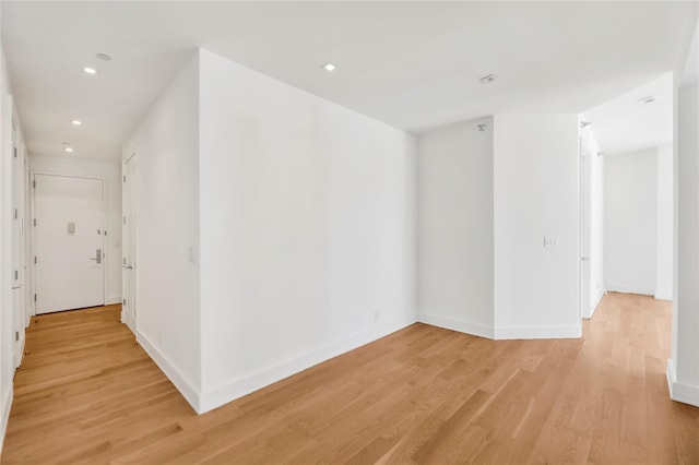 26-26 Jackson Ave Unit 402, Long Island City, NY 11101 - hall with light wood-type flooring, recessed lighting, and baseboards