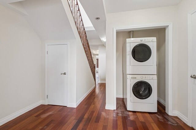 71-19 162nd St Unit 4E, Fresh Meadows, NY 11365 - washroom with stacked washing machine and dryer, hardwood / wood-style flooring, and baseboards