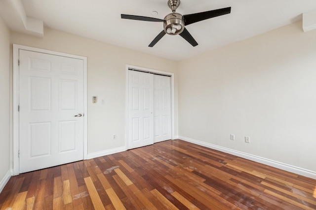 71-19 162nd St Unit 4E, Fresh Meadows, NY 11365 - unfurnished bedroom featuring baseboards, wood finished floors, a closet, and a ceiling fan