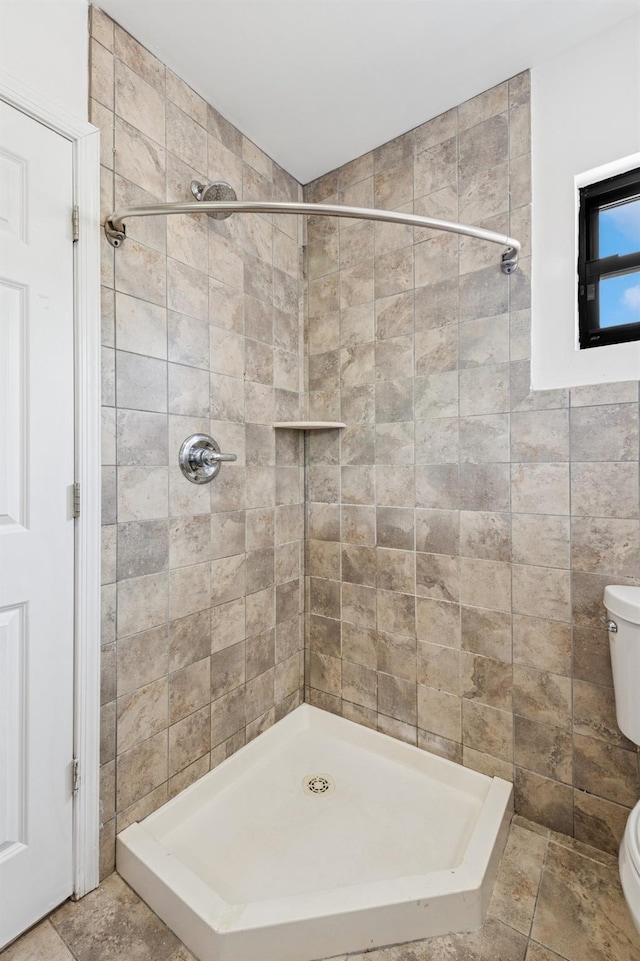 71-19 162nd St Unit 4E, Fresh Meadows, NY 11365 - full bath with toilet, a stall shower, and tile walls