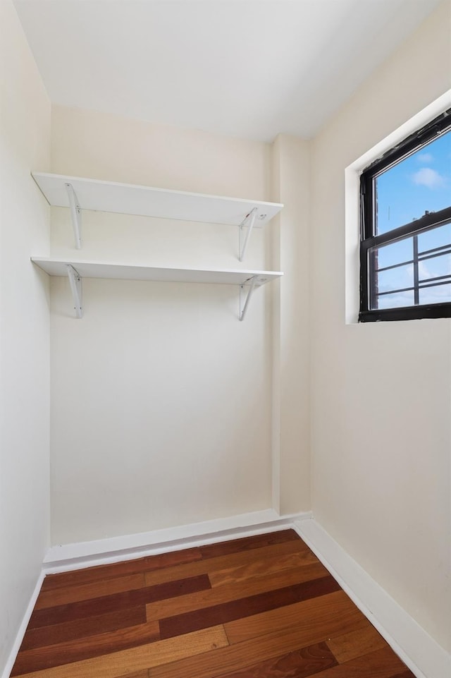 71-19 162nd St Unit 4E, Fresh Meadows, NY 11365 - walk in closet with dark wood-type flooring