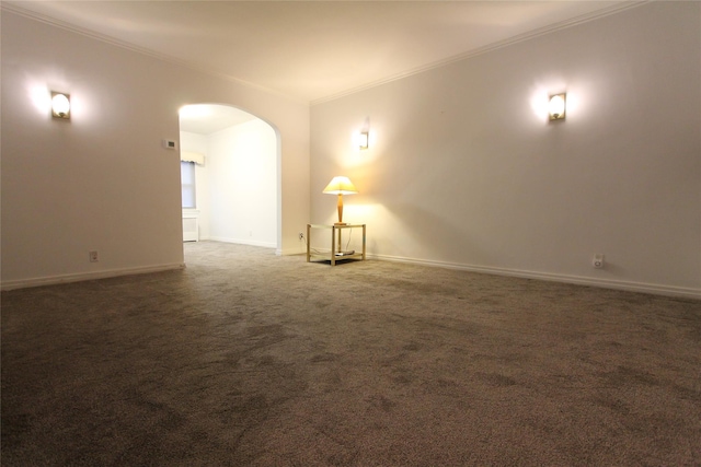 61-16 84th St, Middle Village, NY 11379 - spare room featuring ornamental molding, arched walkways, baseboards, and carpet floors