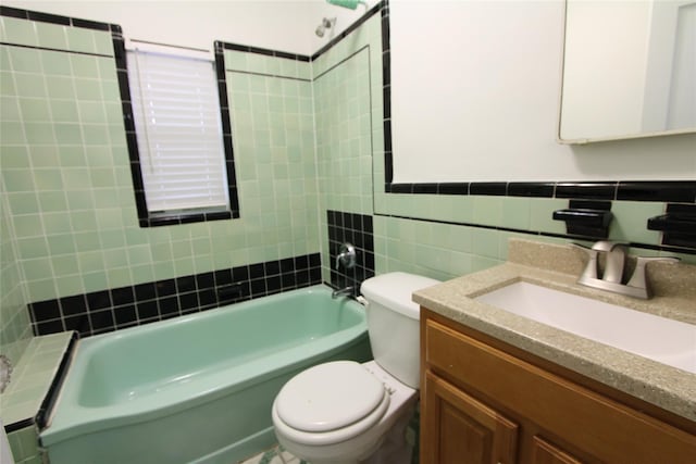 61-16 84th St, Middle Village, NY 11379 - full bathroom with toilet, tile walls, vanity, and bathing tub / shower combination