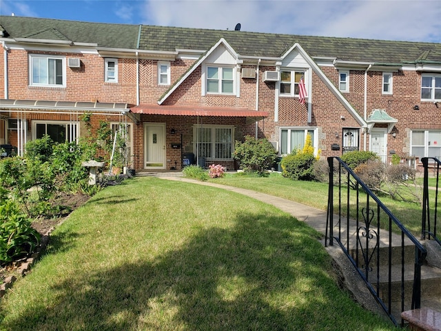 61-16 84th St, Middle Village, NY 11379 - view of property featuring a front yard and brick siding