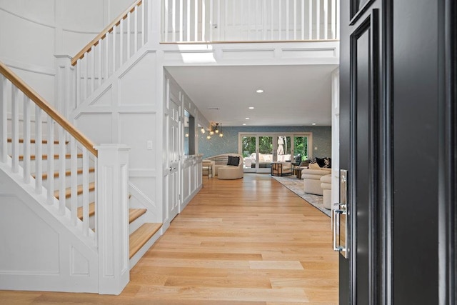 2 Field Ln, Roslyn Heights, NY 11577 - entryway with stairway, light wood-style floors, recessed lighting, and a towering ceiling