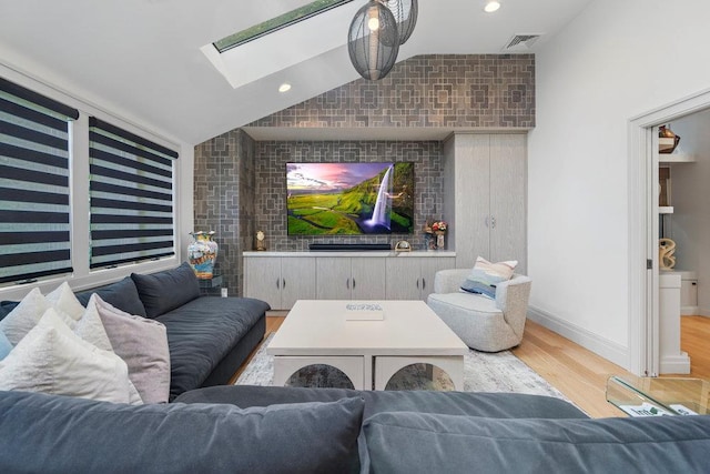 2 Field Ln, Roslyn Heights, NY 11577 - living room featuring wood finished floors, lofted ceiling, a skylight, and baseboards