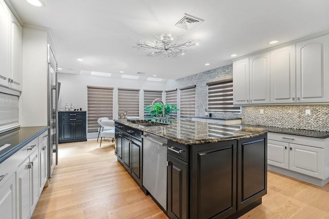 2 Field Ln, Roslyn Heights, NY 11577 - kitchen with dishwasher, a sink, white cabinets, a center island, and recessed lighting