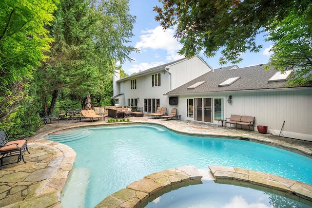 2 Field Ln, Roslyn Heights, NY 11577 - view of swimming pool with a patio area, a pool with connected hot tub, an outdoor living space, and french doors