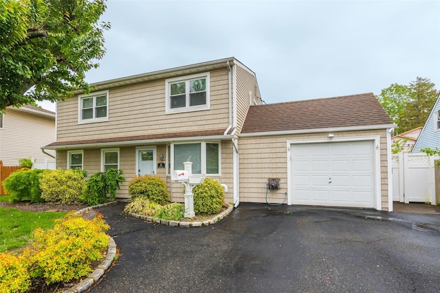 11 Myrtle Ln, Levittown, NY 11756 - traditional-style house with a garage and driveway
