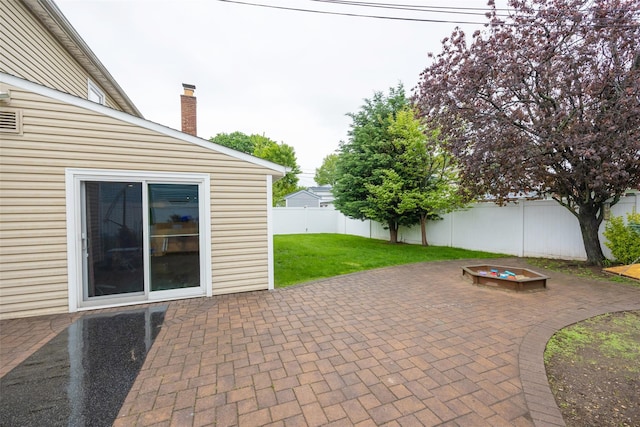11 Myrtle Ln, Levittown, NY 11756 - view of patio featuring an outdoor fire pit