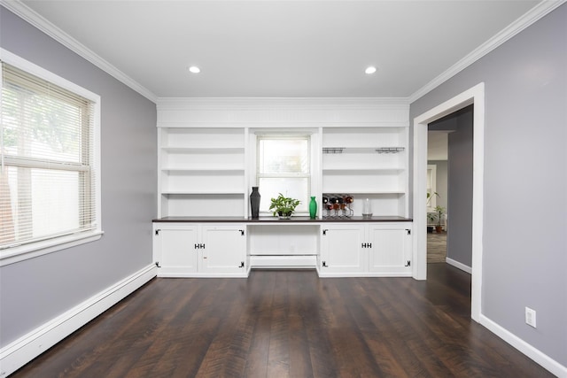 11 Myrtle Ln, Levittown, NY 11756 - bar area featuring a baseboard radiator, crown molding, baseboards, dark wood-type flooring, and built in features
