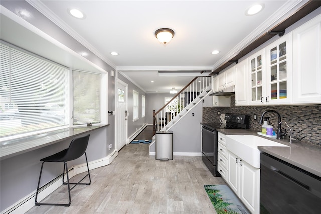 11 Myrtle Ln, Levittown, NY 11756 - kitchen with black range with electric stovetop, dishwasher, ornamental molding, baseboard heating, and glass insert cabinets