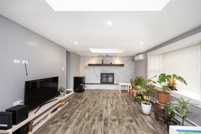 11 Myrtle Ln, Levittown, NY 11756 - living room with a skylight, an AC wall unit, a fireplace, wood finished floors, and a baseboard radiator