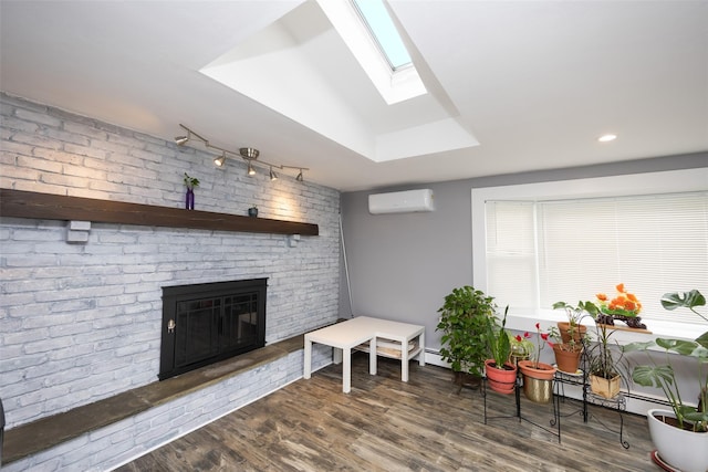 11 Myrtle Ln, Levittown, NY 11756 - living area with a wall mounted air conditioner, a skylight, wood finished floors, a brick fireplace, and recessed lighting