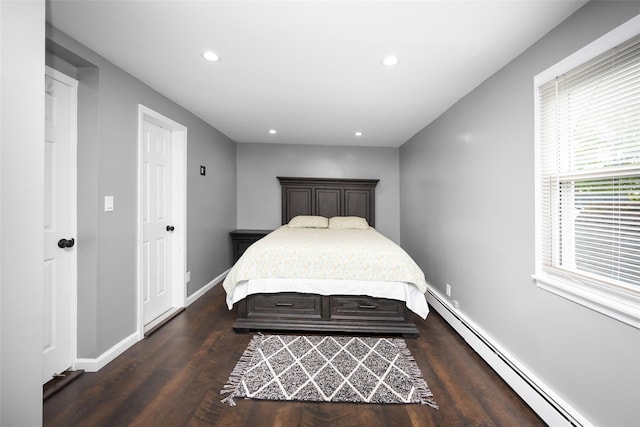 11 Myrtle Ln, Levittown, NY 11756 - bedroom with a baseboard radiator, dark wood-style flooring, recessed lighting, and baseboards