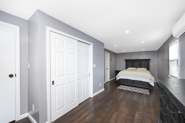 11 Myrtle Ln, Levittown, NY 11756 - bedroom with dark wood-style floors, baseboards, a closet, a wall mounted AC, and recessed lighting