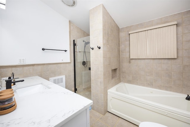 11 Myrtle Ln, Levittown, NY 11756 - full bath with tile walls, a garden tub, a tile shower, vanity, and tile patterned flooring