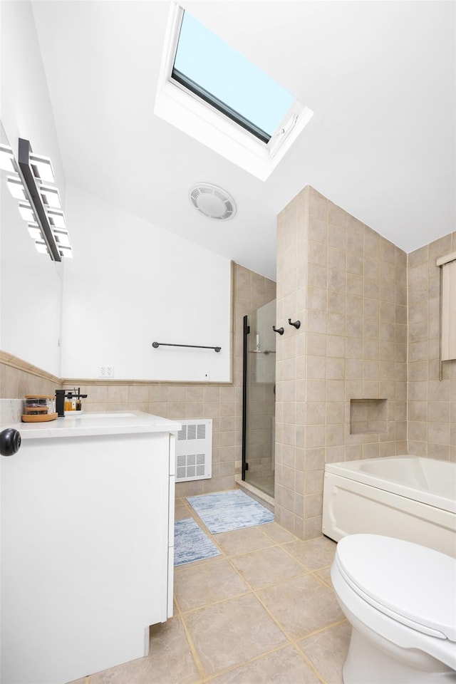 11 Myrtle Ln, Levittown, NY 11756 - full bathroom with tile walls, tiled shower, toilet, a skylight, and vanity