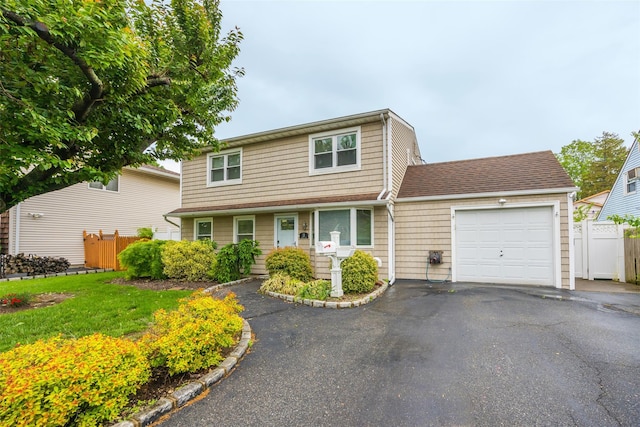 11 Myrtle Ln, Levittown, NY 11756 - traditional home featuring a garage and driveway