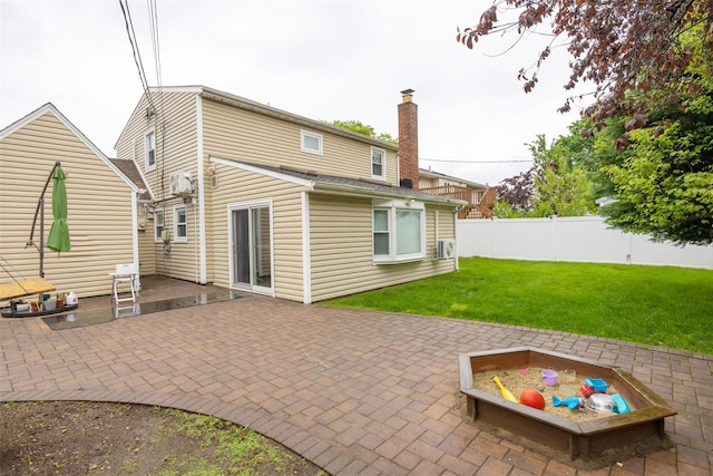 11 Myrtle Ln, Levittown, NY 11756 - rear view of property featuring a patio and a chimney