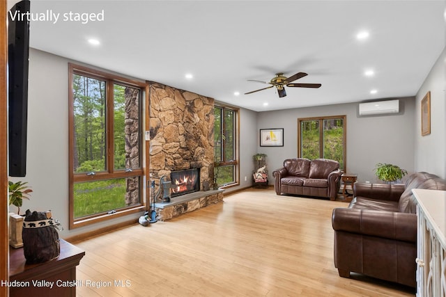 48 Deer Park Rd, Cairo, NY 12473 - living area featuring an AC wall unit, a ceiling fan, a fireplace, recessed lighting, and plenty of natural light