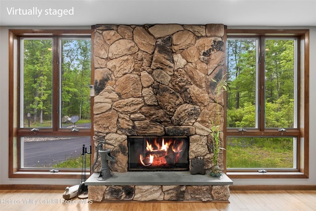 48 Deer Park Rd, Cairo, NY 12473 - detailed view of a stone fireplace, wood finished floors, and baseboards