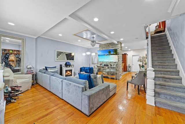 3632 Willett Ave, Bronx, NY 10467 - living area featuring a lit fireplace, light wood-style floors, stairway, ceiling fan, and recessed lighting