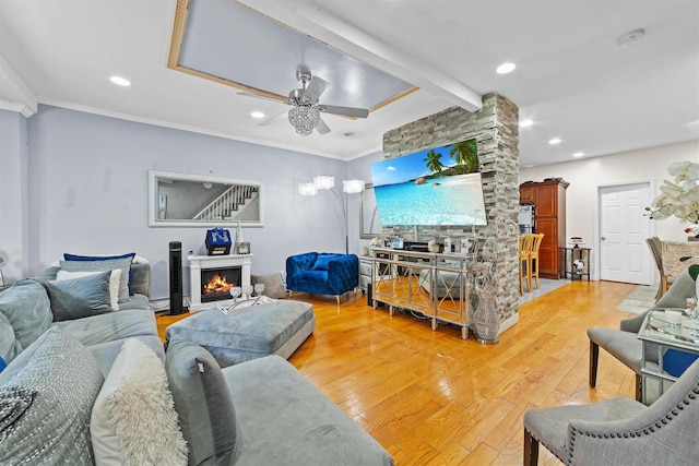 3632 Willett Ave, Bronx, NY 10467 - living room with light wood-style flooring, ceiling fan, a lit fireplace, recessed lighting, and crown molding
