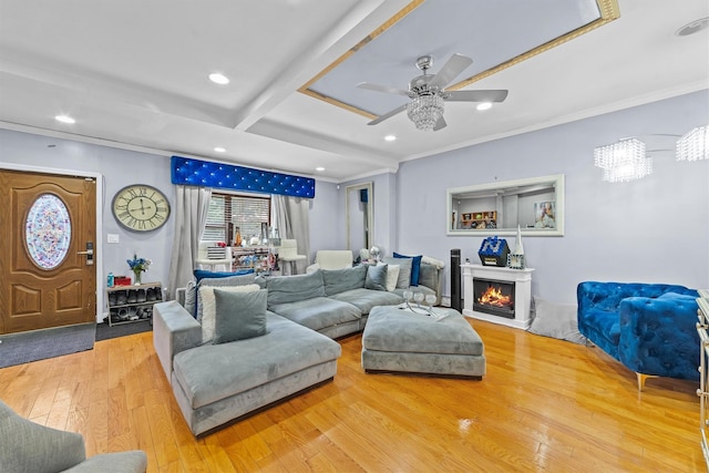 3632 Willett Ave, Bronx, NY 10467 - living area featuring hardwood / wood-style floors, a ceiling fan, recessed lighting, ornamental molding, and a warm lit fireplace