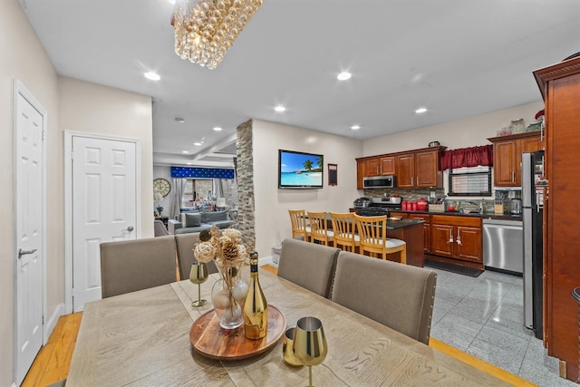 3632 Willett Ave, Bronx, NY 10467 - dining area with baseboards, recessed lighting, and a chandelier