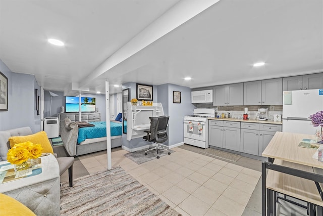 3632 Willett Ave, Bronx, NY 10467 - kitchen with white appliances, gray cabinetry, tasteful backsplash, light countertops, and recessed lighting