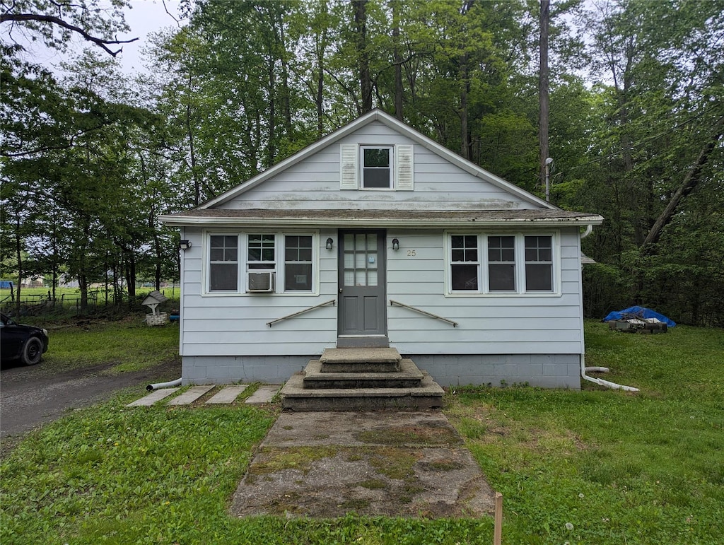 25 Birch St, Pine Bush, NY 12721 - bungalow-style house featuring a front yard, cooling unit, and a shingled roof
